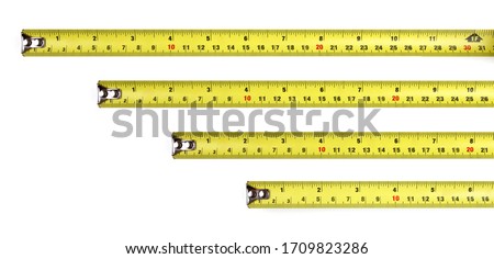 Yellow measuring tape isolated on white background, Top View.  12 in. Royalty-Free Stock Photo #1709823286