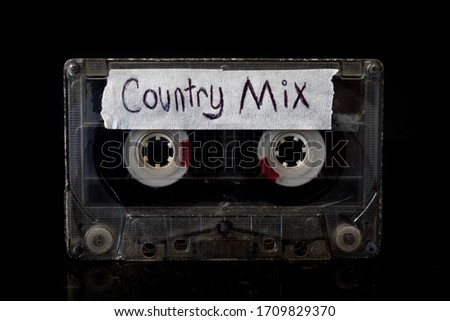 Country Music  Mixtape
A Country Music Cassette tape with a back background.