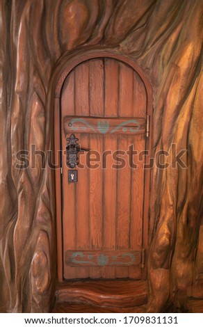 Small wooden door in a tree