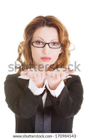 Happy business woman showing copy space on her palm, isolated on white 