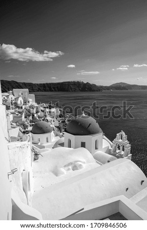 Oia town cityscape at Santorini island in Greece. Aegean sea in black and white