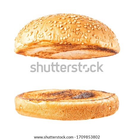 Fresh tasty burger bread isolated on white background. Food background. Royalty-Free Stock Photo #1709853802