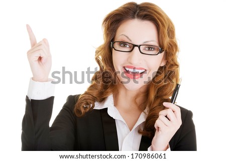 Happy business woman showing copy space, isolated on white 