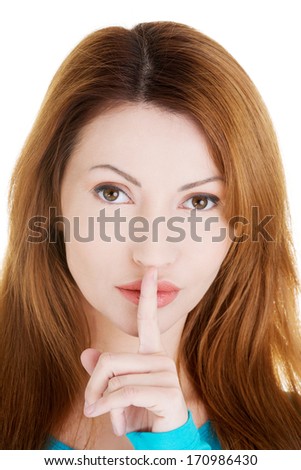 Hush be quiet woman isolated. Woman with finger on her lips. 