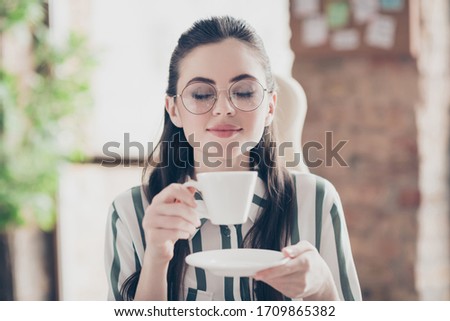 Close-up portrait of her she nice attractive smart clever dreamy girl specialist executive assistant secretary enjoying espresso at modern brick loft industrial interior style work place station