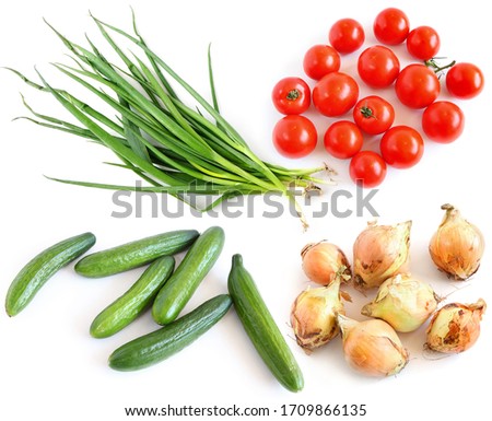 Farming fresh vegetables in assortment on a white background. White onion. Green onions. Cucumbers. Ripe red round tomatoes