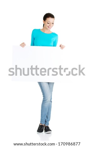 Portrait young happy woman with blank board , isolated on white 