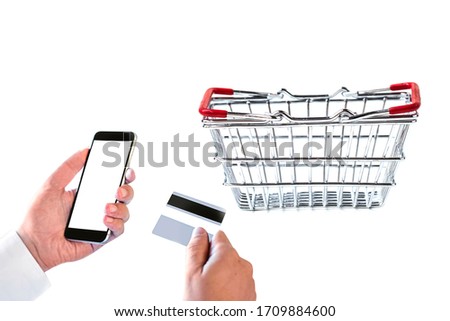 business man hand hold smart phone or cellphone and credit card with shopping basket  isolated on white background.