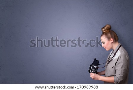 Photographer girl shooting images with copyspace area