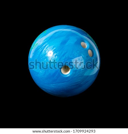 Bowling ball blue. Isolated on a black background close-up.