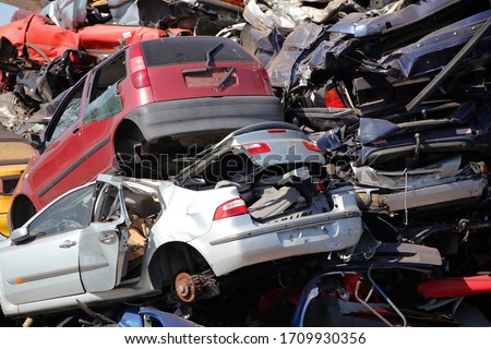 Abandoned automobiles on a car scrapyard, Holland Royalty-Free Stock Photo #1709930356