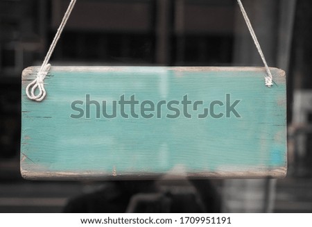 Blank sign in a shop window with reflections and copy space