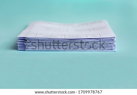 Stack Folding drawings on a blue background. Copy space.