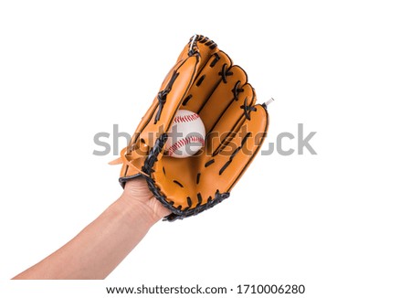 Baseball glove catches a baseball.	