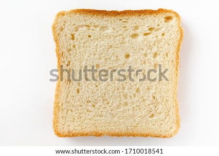 Slices toast bread isolated on white background. Top view, flat lay Royalty-Free Stock Photo #1710018541