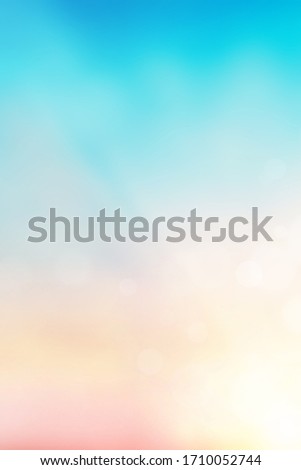 Blur pastels gradient sunset background on soft nature sunrise peaceful morning beach outdoor for wallpaper smartphone. heavenly mind view at a resort deck touching sunshine, sky summer clouds.