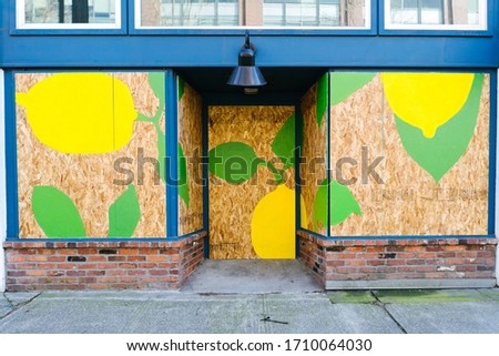 A mural on a boarded up storefront during the coronavirus pandemic