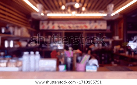 blurred view of cozy wooden coffee cafe in Thailand in the morning.