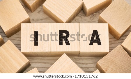 ira individual retirement account inscription on wooden blocks save money concept Royalty-Free Stock Photo #1710151762