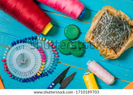 Set of tailoring tools and accessories on table