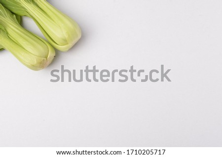 Green vegetable on white background. View Pak Choy vegetable. Selective focus.