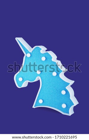 Bedside lamp blue unicorn head, isolated, children's party decoration