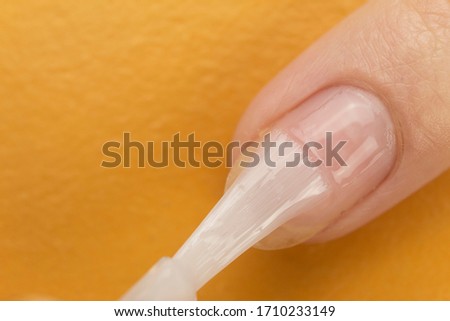 Colorless nail polish that exfoliateþ Nail and cuticle care for onycholysis Royalty-Free Stock Photo #1710233149