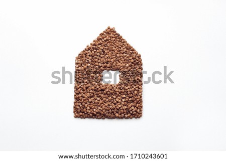 buckwheat in the form of a house on a white background, coronavirus food delivery