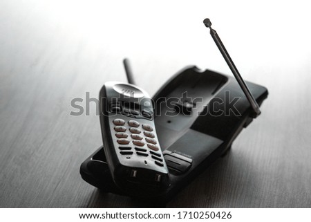 Wireless cordless telephone on the table. Selective focus. Royalty-Free Stock Photo #1710250426