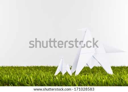 Origami horse on grass