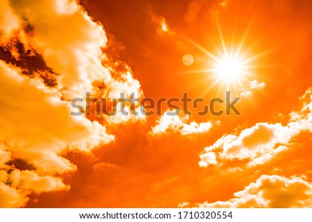 Hot summer or heat wave background, glowing sun on orange sky with thermometer Royalty-Free Stock Photo #1710320554
