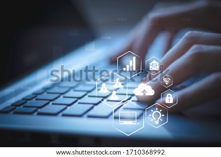 Blurred businesswoman working with laptop computer at home background. Internet of things Futuristic ai technology, social media, big data and Social distancing with virtual icons interface.