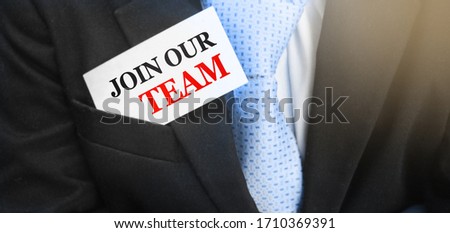 Join our team message on the card in businessman pocket. Job work hiring teamwork hr management concept.