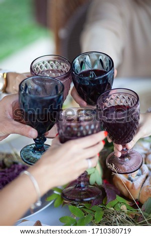 wine in glass glasses that are held in hands