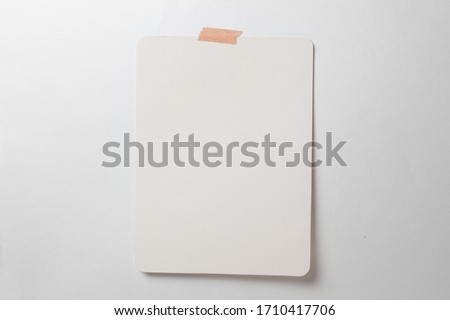white sheet stuck to a white wall