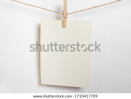 polaroid frame.Retro photo frames hanging on rope isolated on white background. real photo.two frames