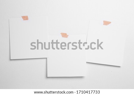 Blank polaroid photo frame with soft shadows and magnet tape isolated on white paper background as template for graphic designers presentations, portfolios etc.
