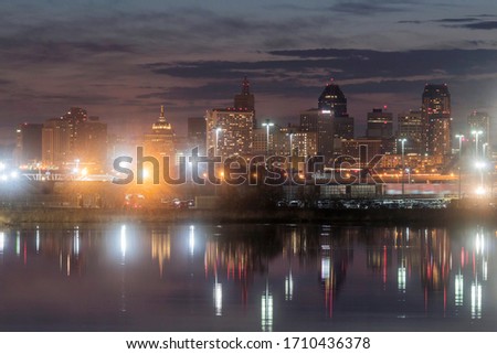 A Skyline Shot of St. Paul Reflecting in Calm Mississippi River Backwaters during a Spring Dusk