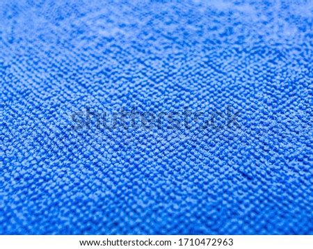 Blue micro fiber cloth close up with abstracted focus.