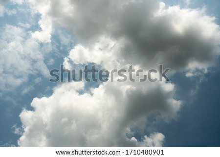 Cumulonimbus cloud formations on tropical blue sky , Nimbus moving , Abstract background from natural phenomenon and gray clouds hunk , Thailand
