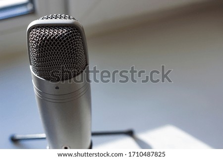 Professional Condenser Microphone. 
Natural light from the window.