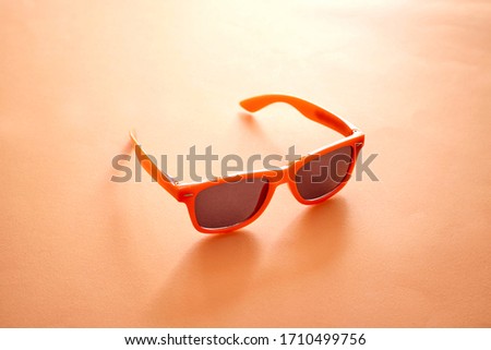A studio photo of a pair of sunglasses