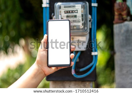 Mobile phones with white screens, including electricity meters for household electrical appliances, electricity usage concepts and electricity usage monitoring.