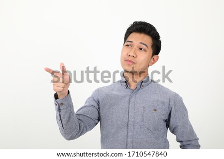 South east Asian Malay Man facial expression show point finger