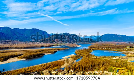 The Fraser River as it flows though the  Coast Mountain range past the town of Chilliwack in the Fraser Valley of British Columbia, Canada Royalty-Free Stock Photo #1710599704