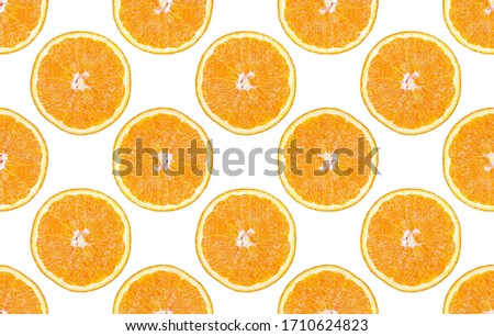 Seamless pattern of isolated slices of orange. Wallpaper for background, design and packaging.