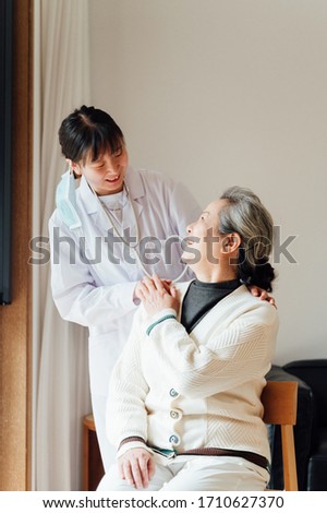 Asian aged woman and doctors