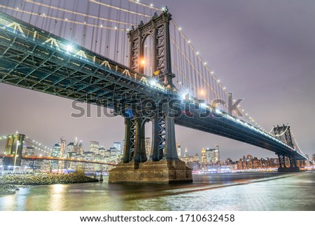 Amazing night view of Manhattan and Brooklyn Bridge at night, winter season, New York City lights