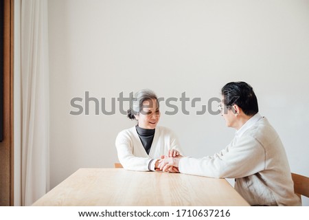 Asian aged couple portrait at home