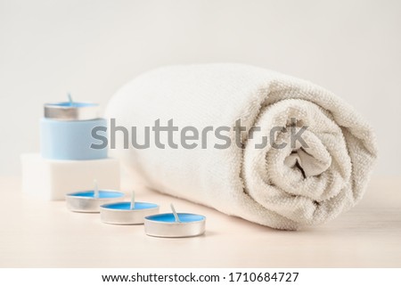 Set of towels, candles and sponges for spa treatments. Aromatherapy spa concept